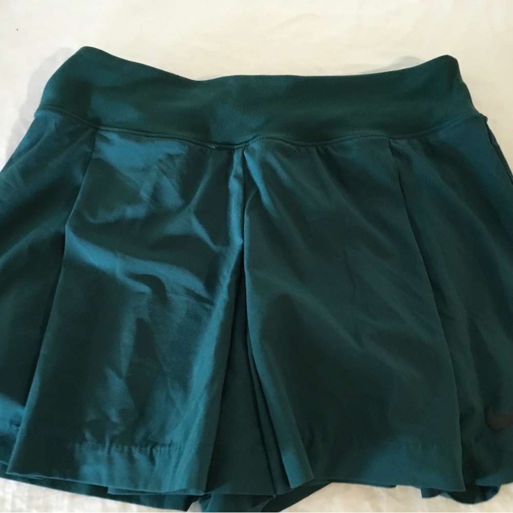 Nike tennis skirt with attached shorts. Excellent condition.